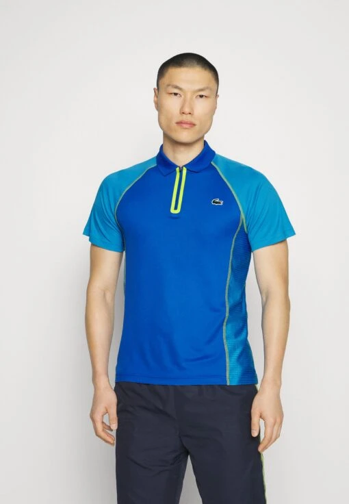 Lacoste Sport Tennis Tour - Poloshirt - Bleu Jaune -Fashion Verkoop 1392b7124a404aff91c3292b1f8a058e scaled