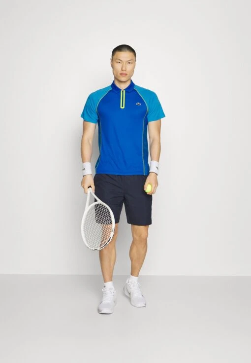 Lacoste Sport Tennis Tour - Poloshirt - Bleu Jaune -Fashion Verkoop 51e9501206c44086a8f7dd4d159ed319 scaled