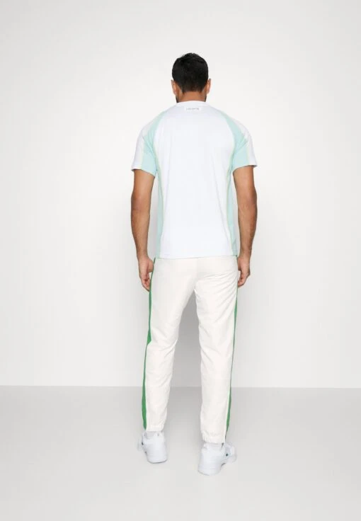 Lacoste Sport Tennis Pant - Trainingsbroek - Flour/Tarragon -Fashion Verkoop 9eeab01d4eda4cb1a8897bdbb836810f scaled