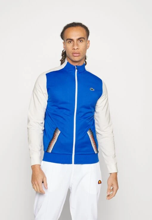 Lacoste Sport Tennis Jacket Tapered - Trainingsvest - Kingdom/Flour-Flour-Kingdom -Fashion Verkoop d18a85fc364044baa820af509899725f scaled