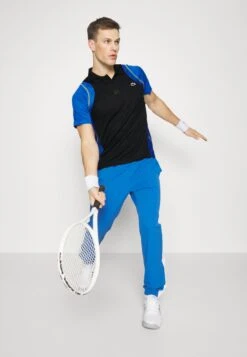 Lacoste Sport Tennis Tour - Poloshirt - Noir/Bleu/Jaune -Fashion Verkoop e3c19bd2b1ca4225b5b1e800d30e2cae